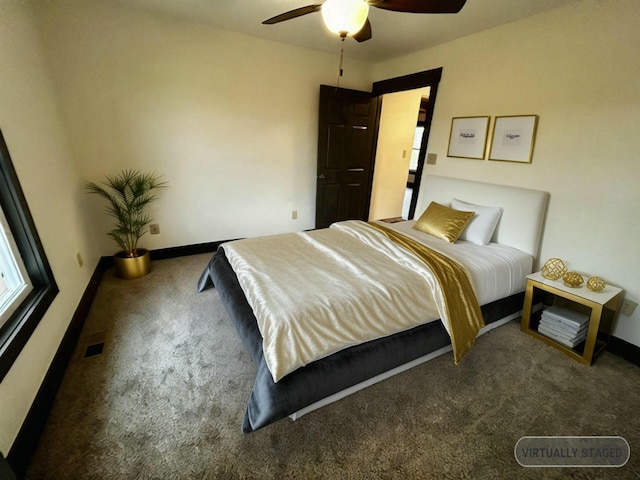 bedroom with dark colored carpet and ceiling fan