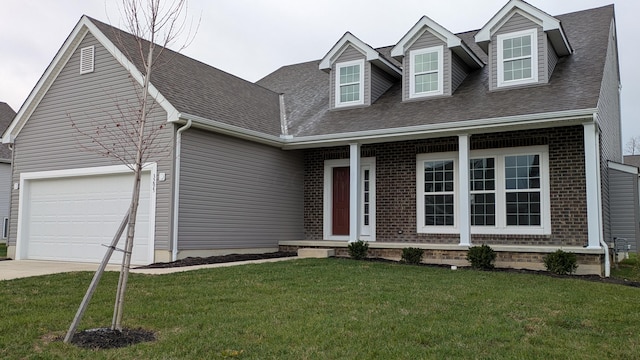 cape cod-style house with a garage and a front yard