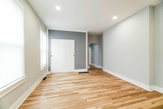 spare room featuring light wood-type flooring