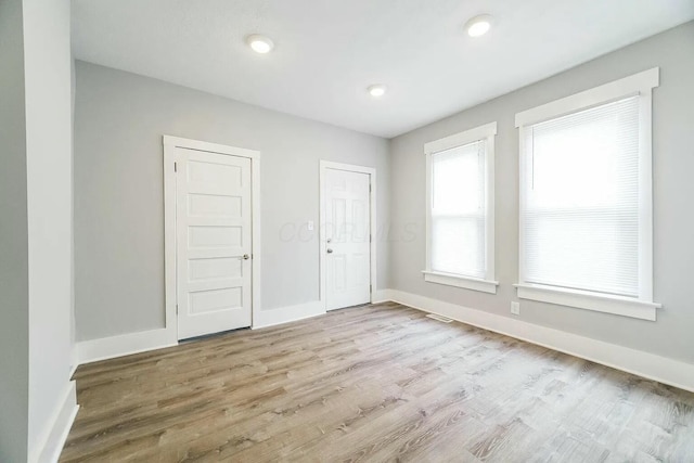 empty room featuring light hardwood / wood-style floors