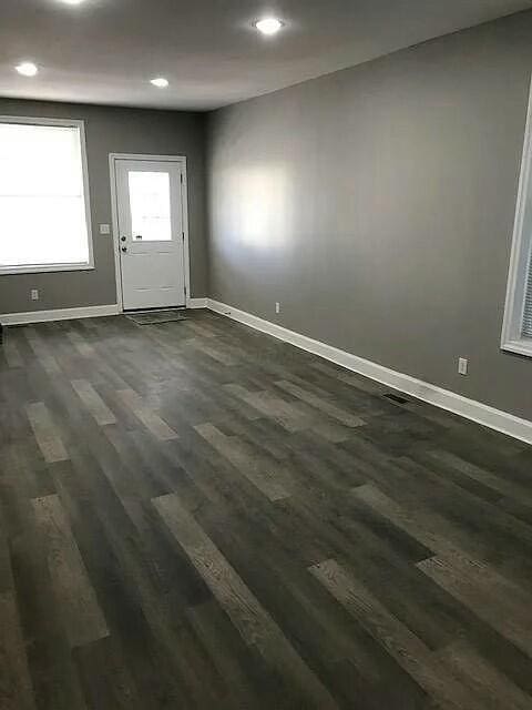 interior space with dark hardwood / wood-style flooring