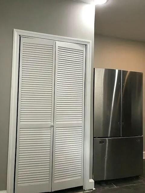 interior details featuring stainless steel fridge