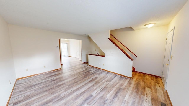 spare room featuring light hardwood / wood-style flooring