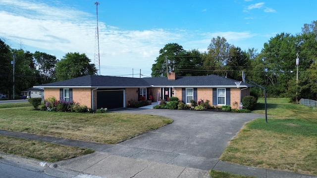 ranch-style home with a garage and a front lawn