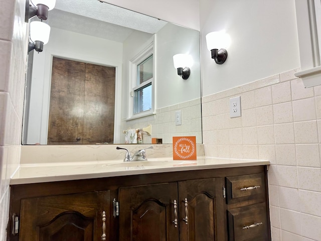 bathroom with vanity and a textured ceiling