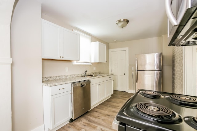 811 S Richardson Ave, Columbus, OH 43204 - kitchen featuring stainless steel appliances, exhaust hood, white cabinets, and light wood-type flooring