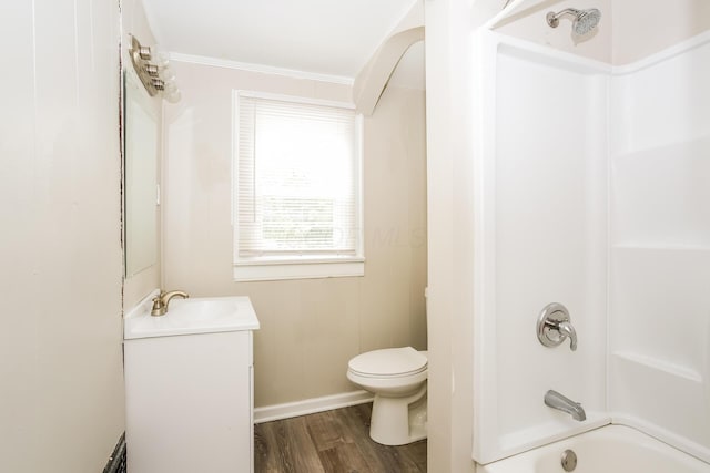 full bathroom with tub / shower combination, hardwood / wood-style floors, toilet, vanity, and ornamental molding