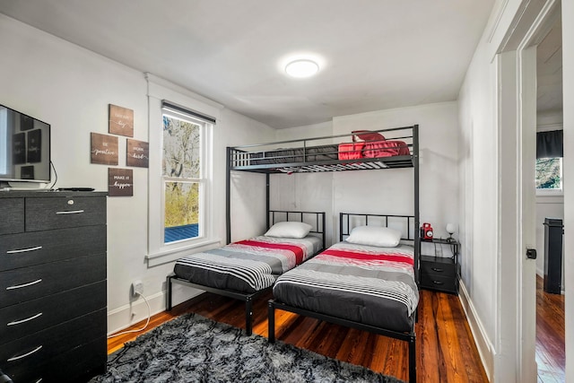 bedroom with hardwood / wood-style floors