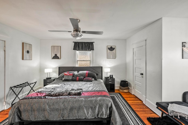 bedroom with ceiling fan and hardwood / wood-style floors