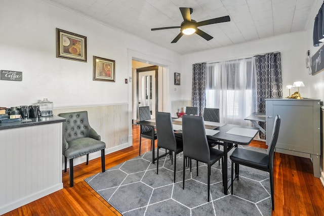 dining room featuring hardwood / wood-style flooring, ceiling fan, and ornamental molding