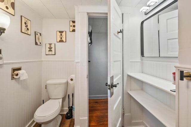 bathroom featuring hardwood / wood-style floors and toilet