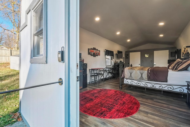 bedroom with dark wood-type flooring and vaulted ceiling