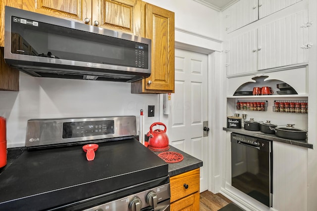 kitchen with stainless steel appliances and dark wood-type flooring