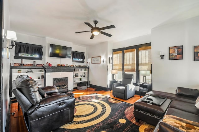 living room with hardwood / wood-style floors and ceiling fan