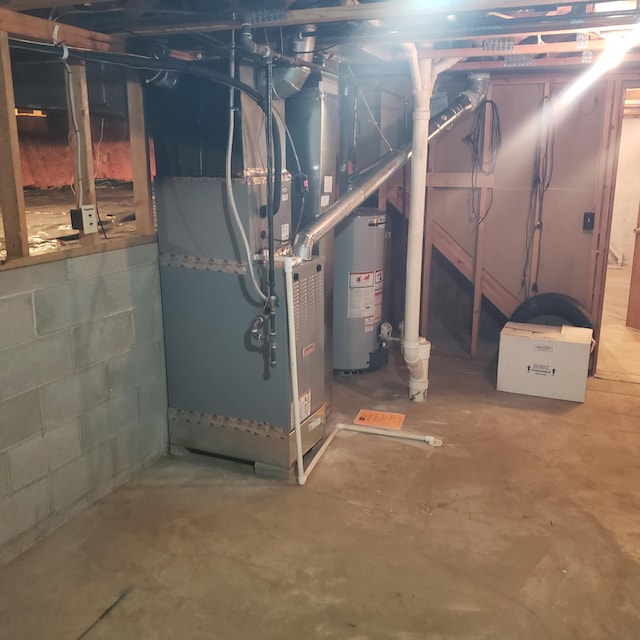 basement featuring heating unit and gas water heater