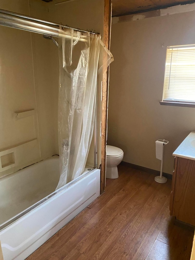 full bathroom featuring wood-type flooring, vanity, toilet, and shower / bath combination with curtain