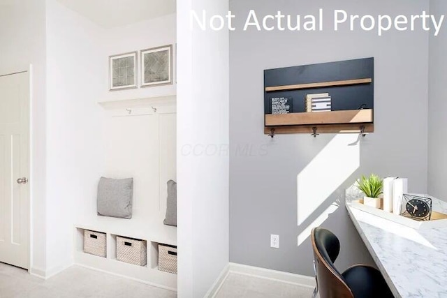 mudroom featuring baseboards