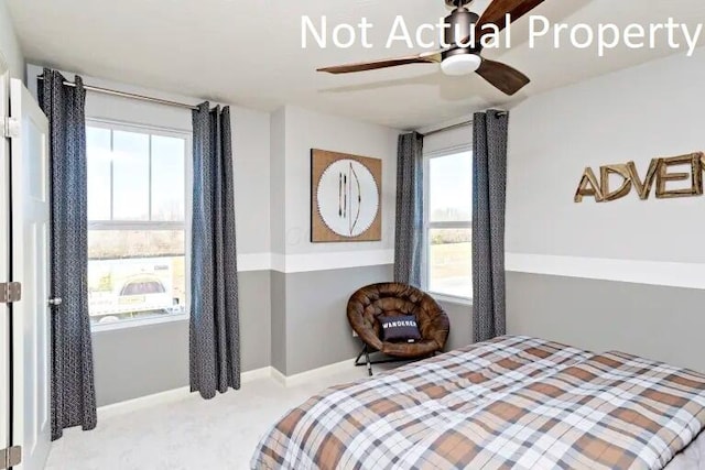 bedroom featuring ceiling fan, baseboards, and carpet floors