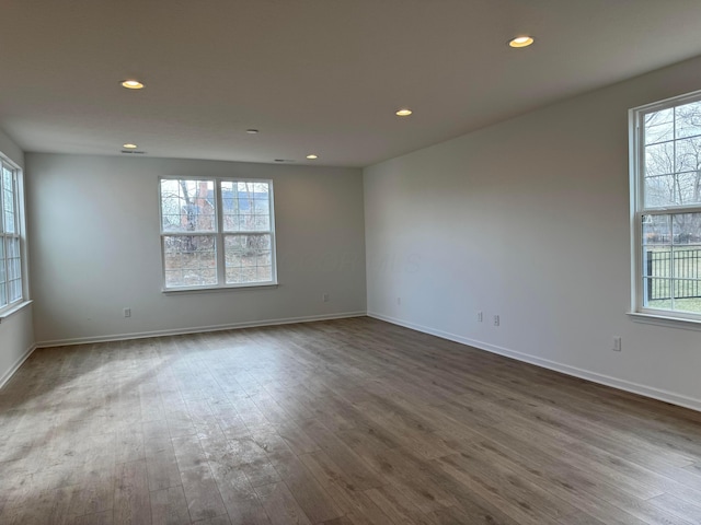 unfurnished room featuring hardwood / wood-style floors