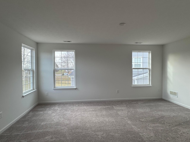 empty room featuring carpet flooring