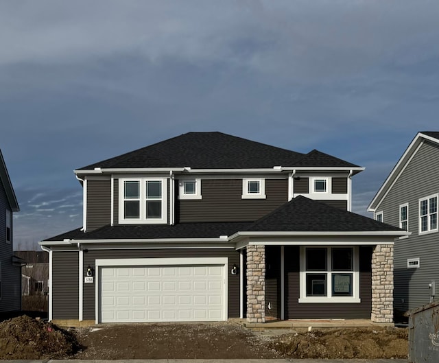 front of property with a garage