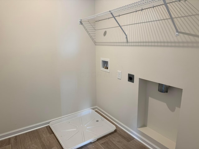 washroom featuring hookup for a washing machine, wood finished floors, baseboards, laundry area, and electric dryer hookup