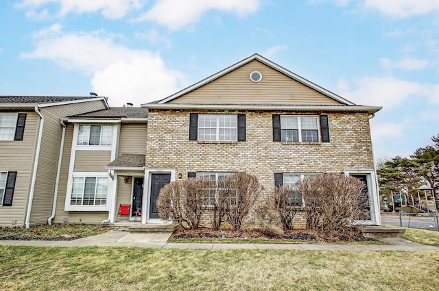 view of property with a front lawn