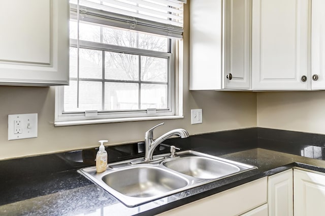 kitchen with sink and white cabinets