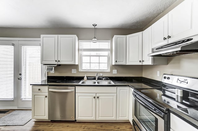 kitchen with sink, white cabinets, and appliances with stainless steel finishes