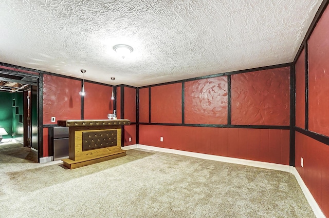 interior space featuring carpet floors and a textured ceiling