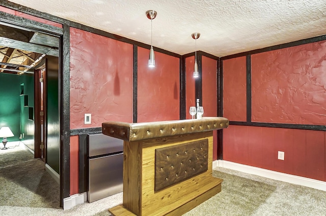 bar with light carpet and a textured ceiling