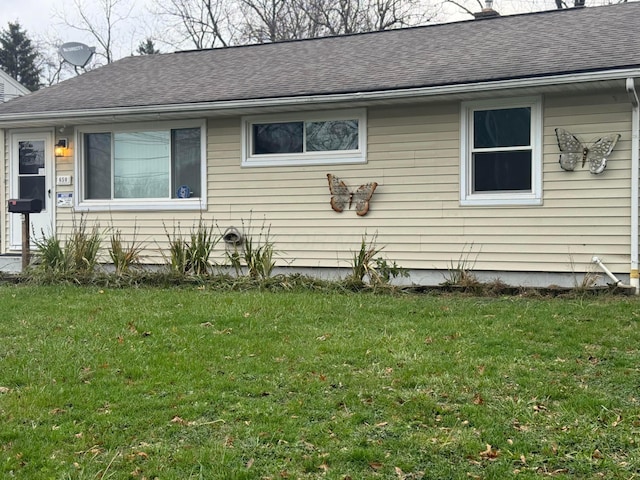 view of home's exterior with a yard