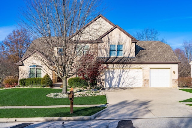 front facade with a front yard and a garage