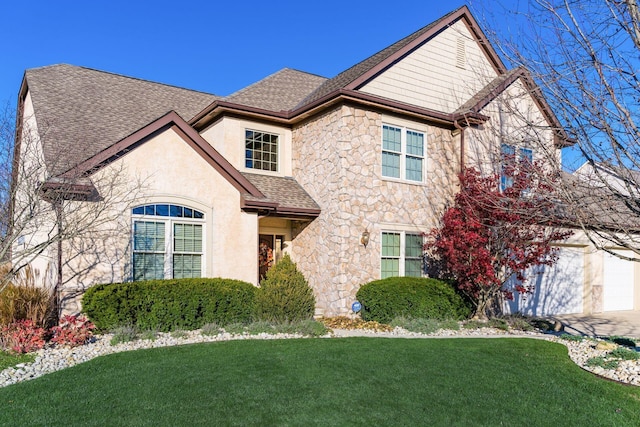 front of property featuring a garage and a front yard