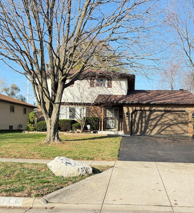 view of front facade with a garage and a front lawn