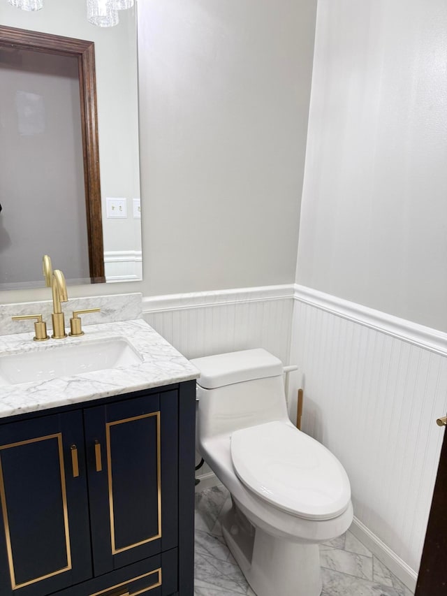 bathroom featuring toilet and vanity