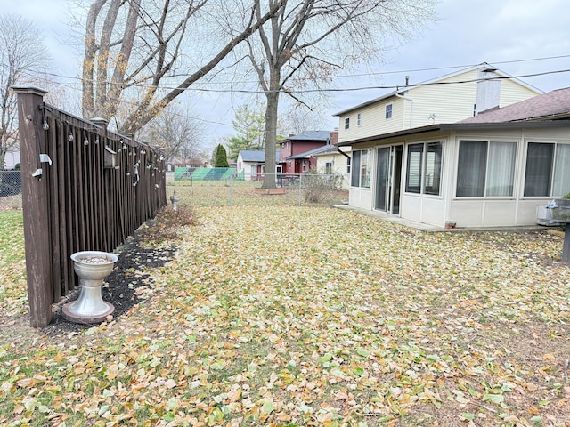 view of yard featuring a sunroom