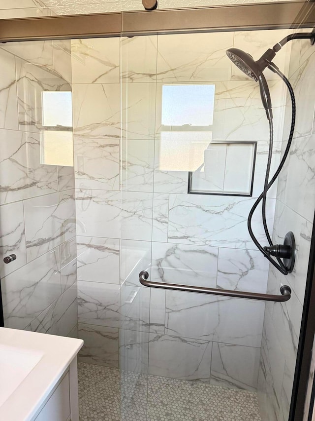 bathroom featuring an enclosed shower