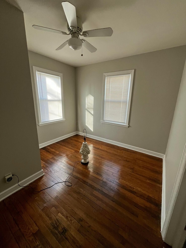 unfurnished room featuring dark hardwood / wood-style flooring and ceiling fan