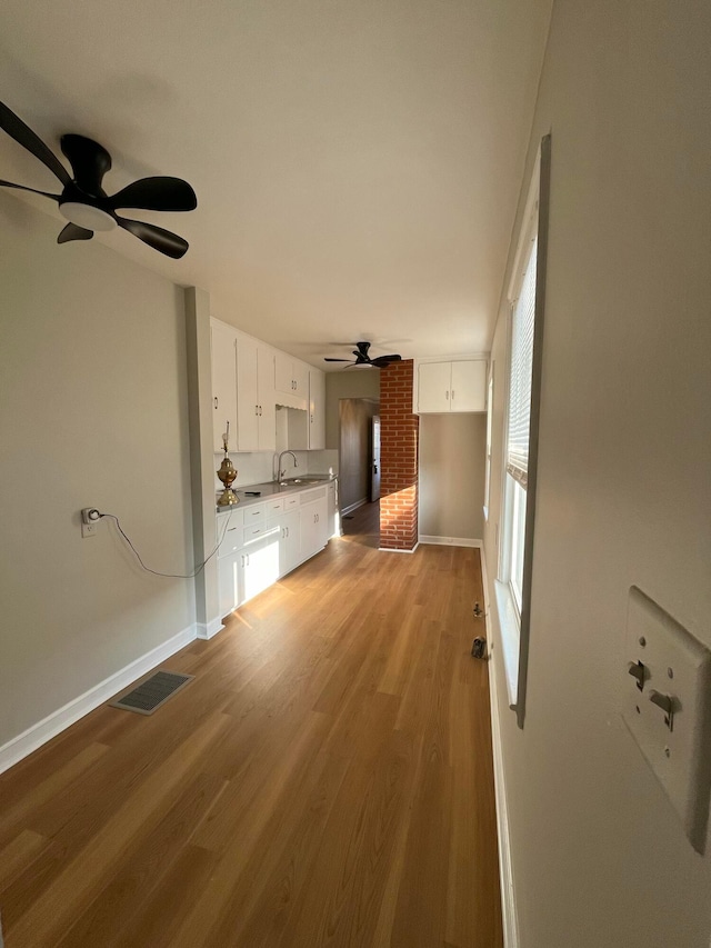 interior space featuring light hardwood / wood-style flooring and sink