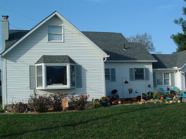 back of house with a yard