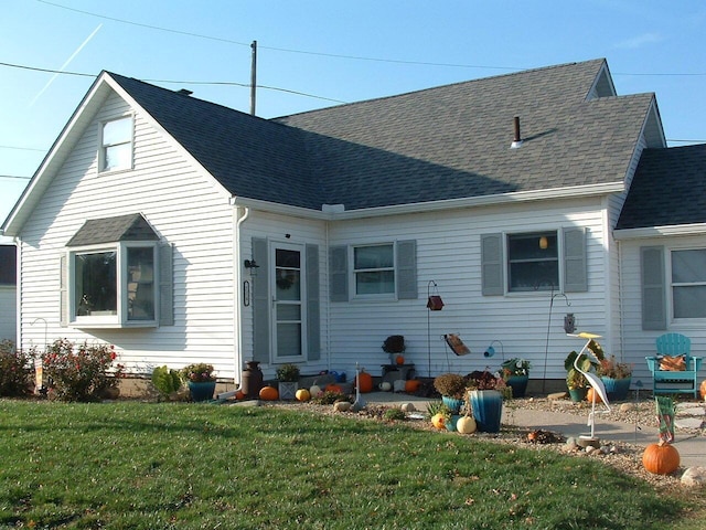 back of house with a yard