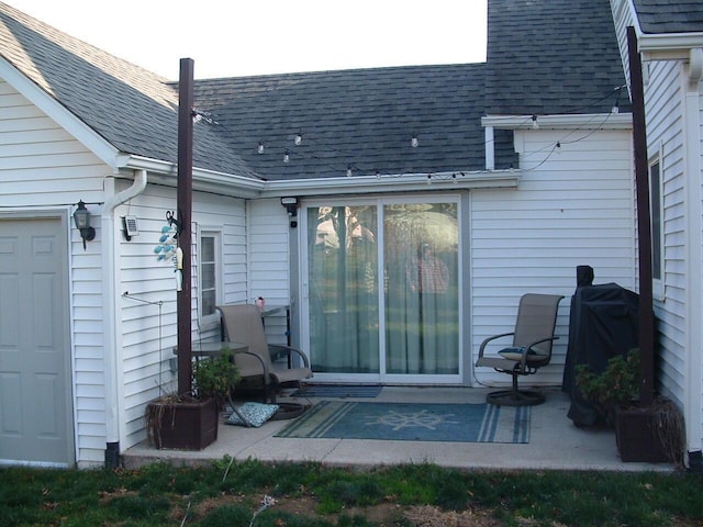 rear view of property featuring a patio area