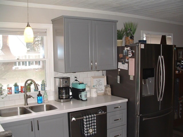 kitchen with dishwasher, stainless steel fridge, plenty of natural light, and sink