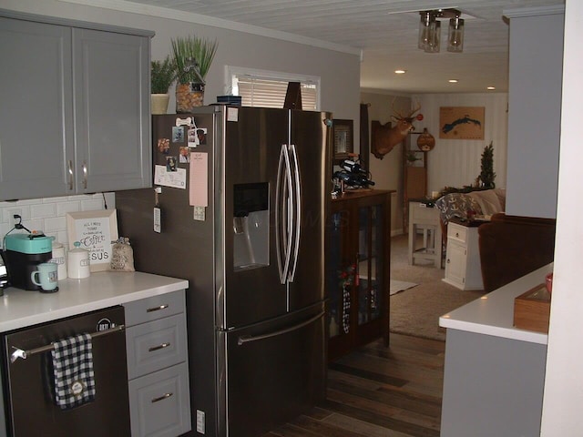 kitchen with stainless steel refrigerator with ice dispenser, ornamental molding, dark wood-type flooring, dishwasher, and gray cabinets