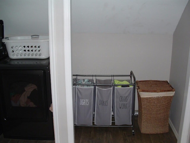 laundry area featuring dark wood-type flooring