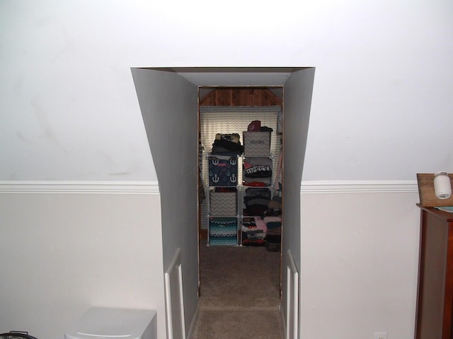 interior space featuring carpet flooring and ornamental molding