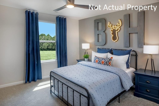 carpeted bedroom featuring a ceiling fan and baseboards