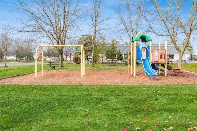 view of jungle gym featuring a lawn