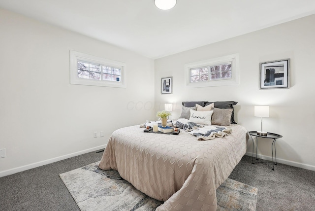 carpeted bedroom featuring multiple windows